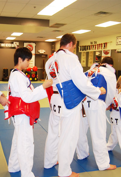 helping each other for sparring gear